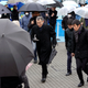 Participants take refuge during an evacuation drill simulating a North Korea ballistic missile attack in Tokyo.